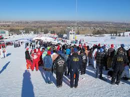 engineering students gather on a ski hill to compete in the Great Northern Concrete Toboggan Race.