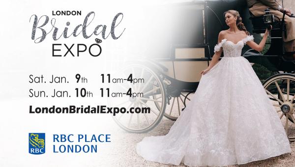 Bride in an elegant off-shoulder wedding gown posing beside a vintage carriage at London Bridal Expo.
